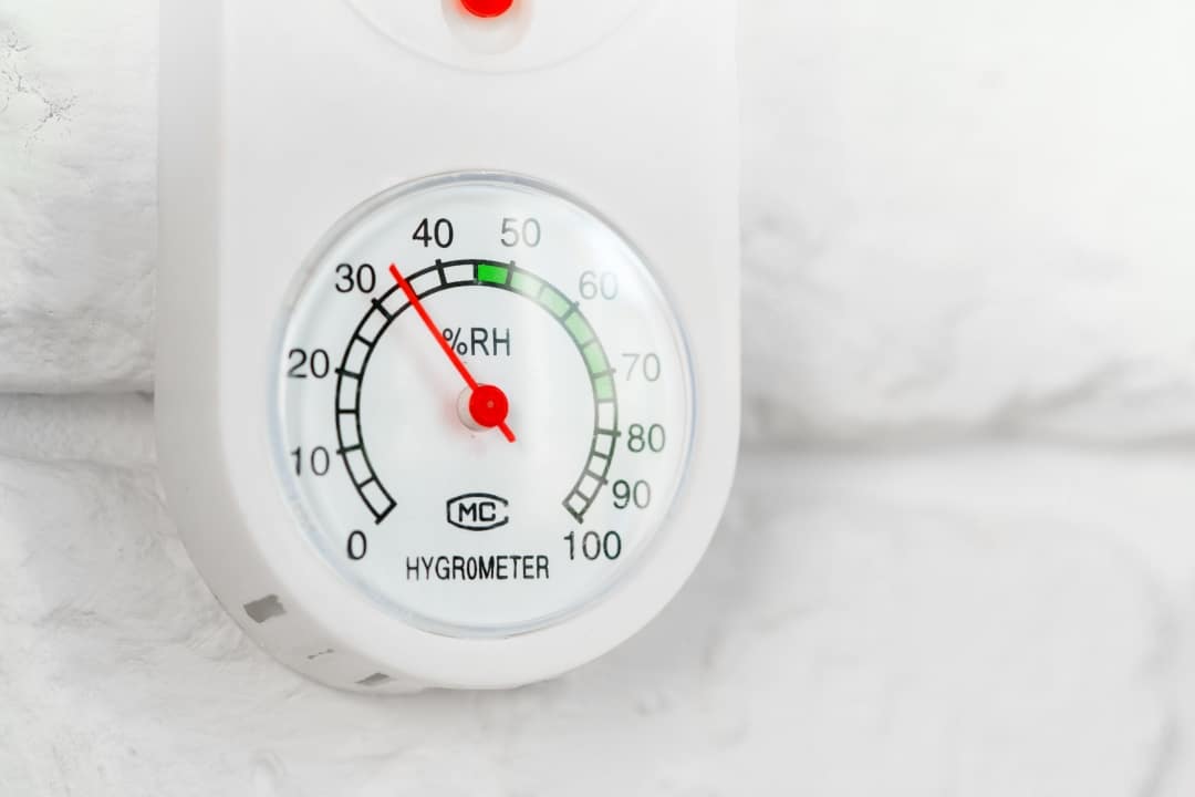 Modern digital humidity monitor displaying optimal indoor humidity levels